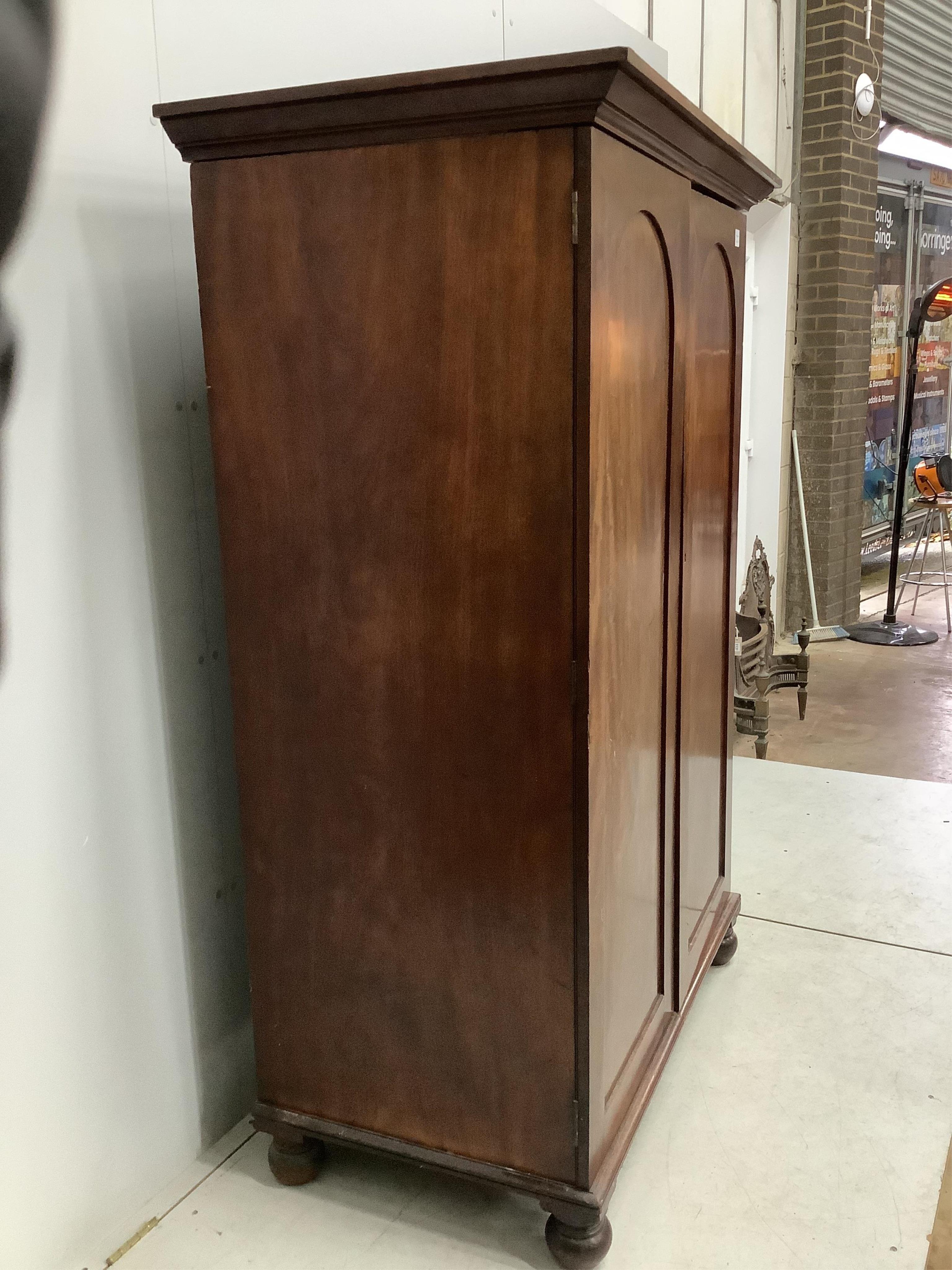 A Victorian mahogany two door hanging wardrobe, adapted, width 119cm, depth 67cm, height 175cm. Condition - poor